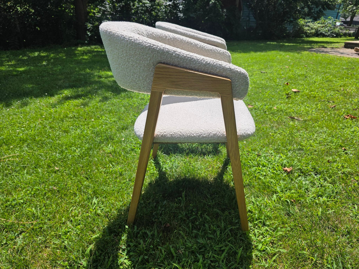 Ivory boucle dining chair, side profile