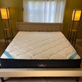 DreamCloud Premier King on a bed frame