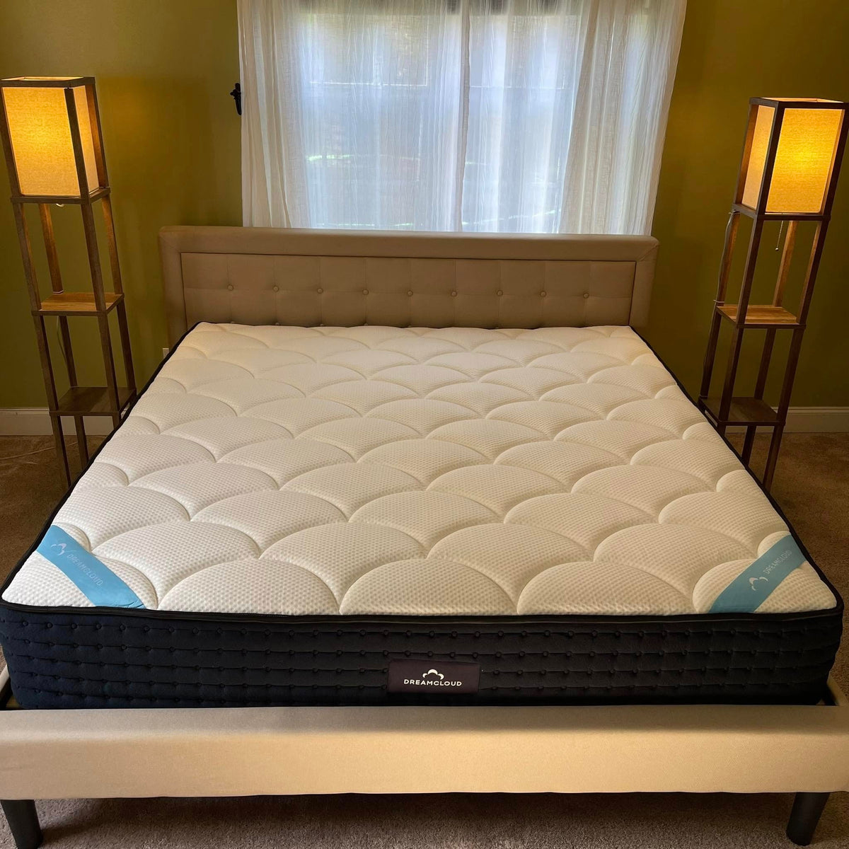 DreamCloud Premier King on a bed frame